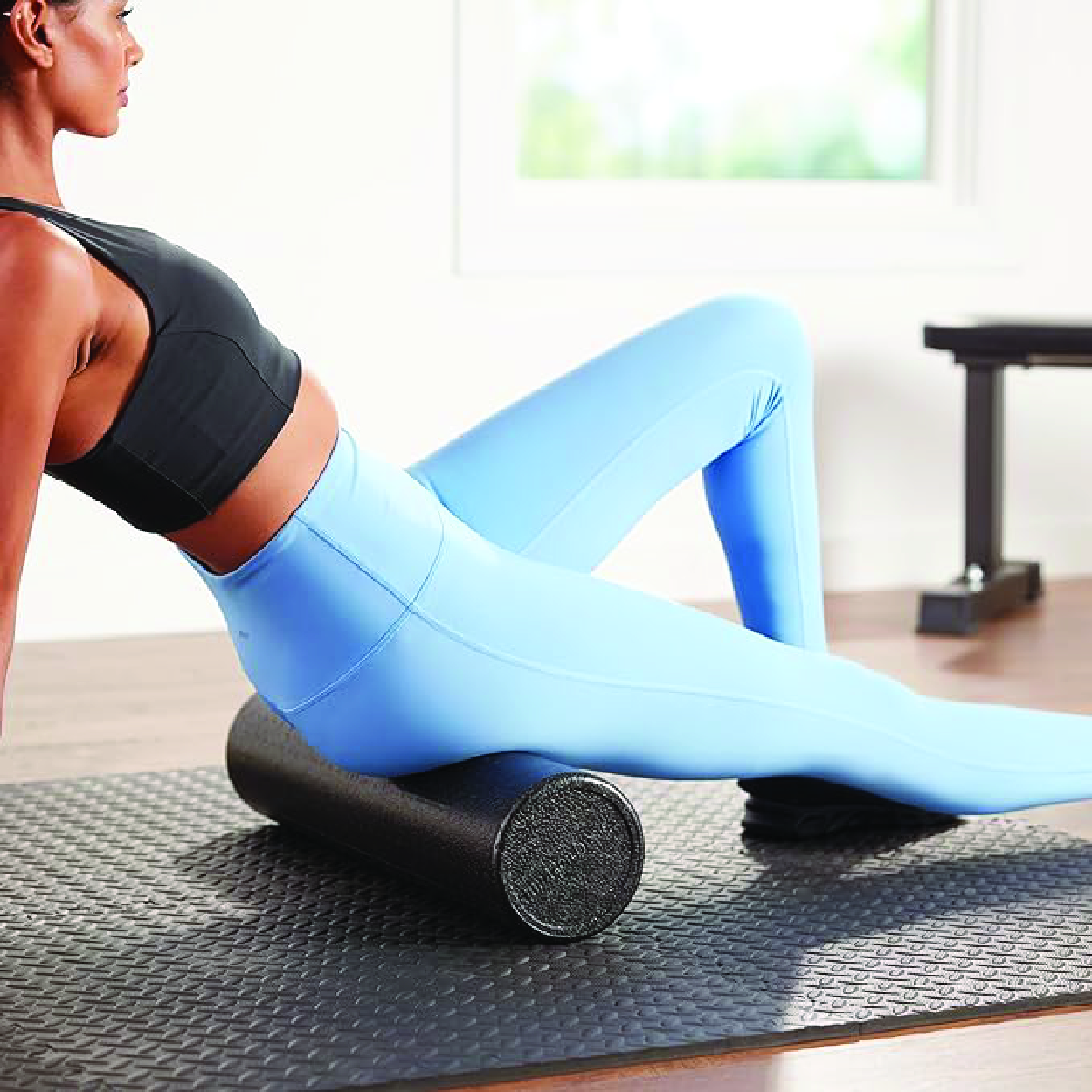 Compact and versatile round foam roller, ideal for enhancing muscle flexibility and recovery during fitness exercises.